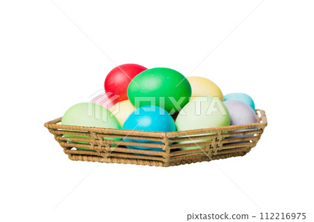 Basket of colorful Easter eggs isolated on white background. Easter basket filled with colored eggs top view holiday concept 112216975