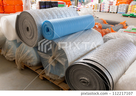 Different Insulation material in rolls for sale on a store warehouse. 112217107
