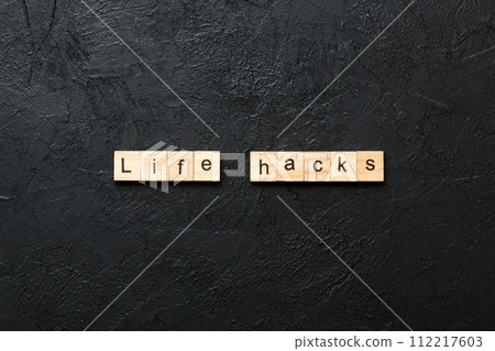 life hacks word written on wood block. life hacks text on table, concept life hacks word written on wood block. life hacks text on table, concept 112217603