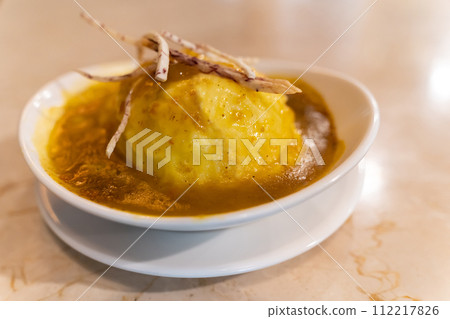 Cheesy mashed potato with deep fried yam strips. 112217826