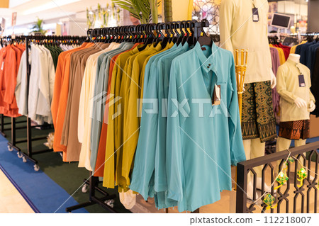 Close-up view of Baju Melayu on hangers for sale. Close-up view of Baju Melayu on hangers for sale. 112218007