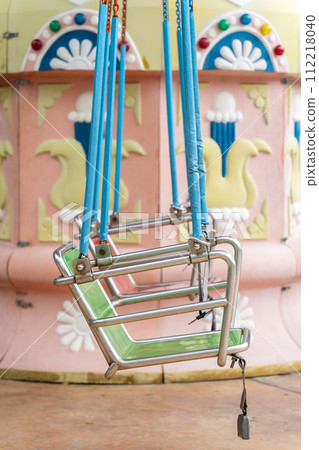 Colorful swing ride at the amusement park 112218040