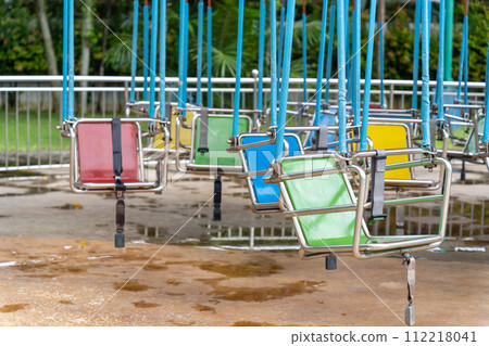 Colorful swing ride at the amusement park 112218041