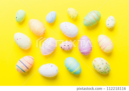 decorative easter eggs on colored background. easter eggs collection top view with copy space 112218116