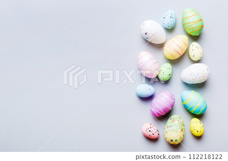 decorative easter eggs on colored background. easter eggs collection top view with copy space decorative easter eggs on colored background. easter eggs collection top view with copy space 112218122