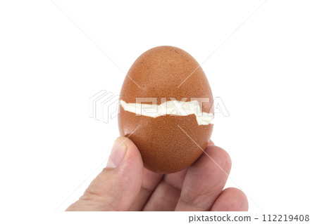 Egg cracked during boiling isolated on white 112219408