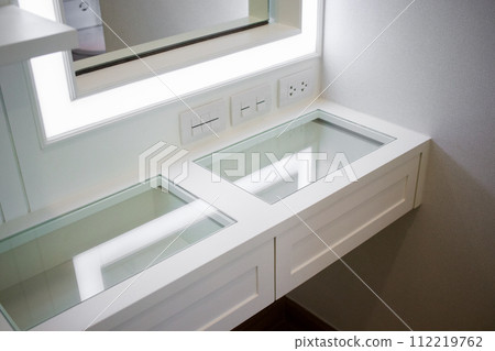 Drawers of a white makeup table 112219762