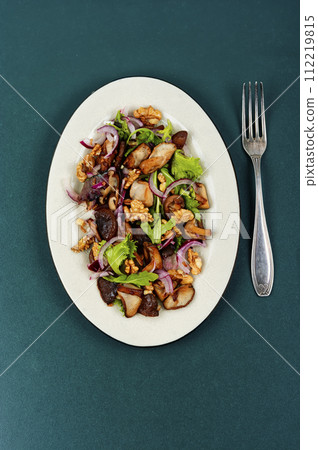 Spicy mushroom salad with onions and walnuts. Spicy mushroom salad with onions and walnuts. 112219815
