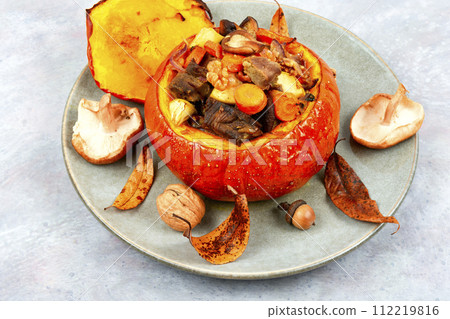 Tasty baked pumpkin with beef and mushrooms. 112219816