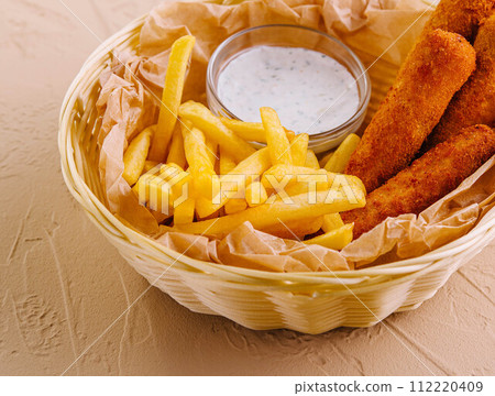 Fried chicken nuggets with french fries Fried chicken nuggets with french fries 112220409