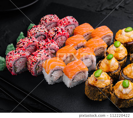Sushi set on black slate top view 112220422