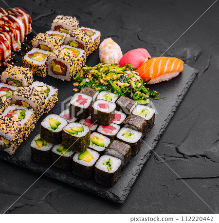 Sushi set on black stone background 112220442