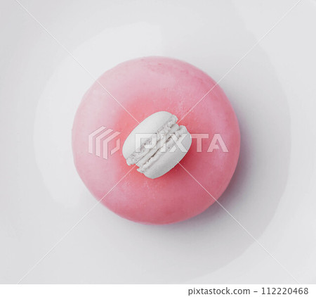 Pink mousse cake decorated with white macaroon Pink mousse cake decorated with white macaroon 112220468