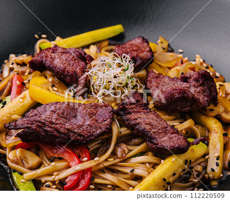 Chinese noodles with roasted duck and fried vegetables Chinese noodles with roasted duck and fried vegetables 112220509