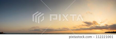 panorama of a golden sunrise at the black sea. fluffy clouds cover the sun above horizon. good weather forecast on summer vacation panorama of a golden sunrise at the black sea. fluffy clouds cover the sun above horizon. good weather forecast on summer vacation 112221001