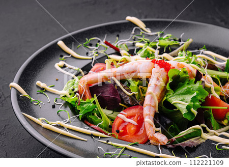Healthy salad with shrimps close up 112221109