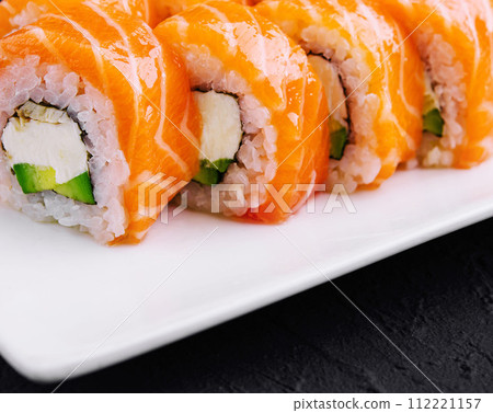 Sushi roll philadelphia with salmon close up 112221157