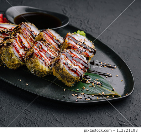 tempura fried rolls on black background tempura fried rolls on black background 112221198