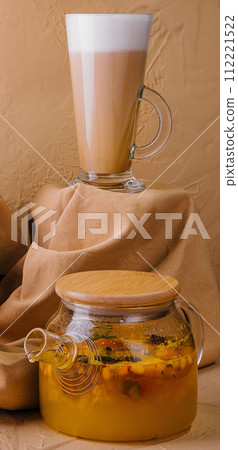 Caramel iced latte with whipped cream and sea buckthorn tea 112221522
