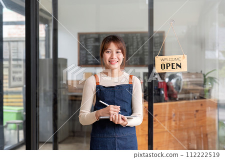 Successful small business owner young asian woman barista stand at her cafe Successful small business owner young asian woman barista stand at her cafe 112222519