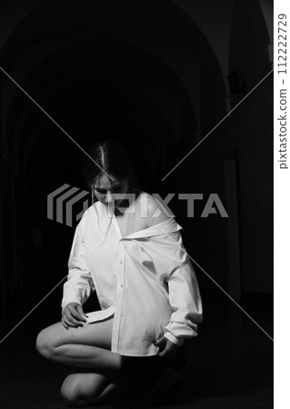 Brunette in men's dress shirt. 112222729