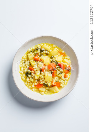 Israeli soup with ptitim, vegetables and spinach. 112222794