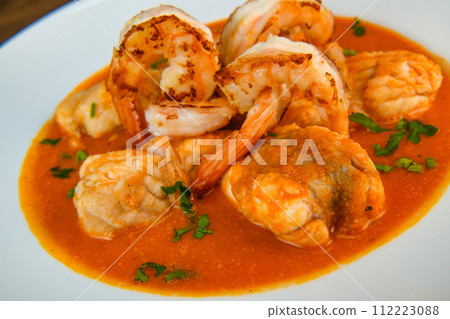 Recipe for Armorican-style monkfish tail, prawns, flambees with cognac Recipe for Armorican-style monkfish tail, prawns, flambees with cognac 112223088
