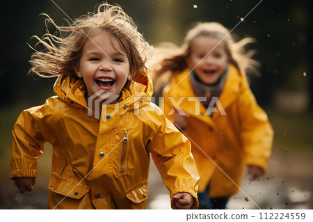 Joyous Autumn Splash Playful Children in Yellow Raincoats Dancing Through Puddles on a Rainy Day Stroll. created with Generative AI 112224559
