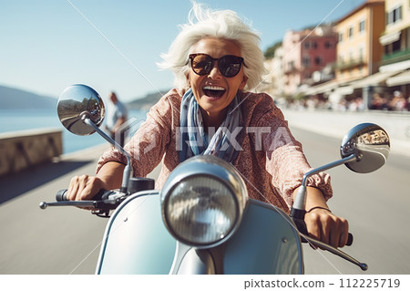 Joyful Senior Woman on Blue Scooter Explores Italy During Summer Vacation - Vibrant Retirement Adventure. created with Generative AI 112225719