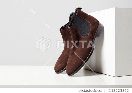 fashion female shoes still life. stylish brown chelsea boots fashion female shoes still life. stylish brown chelsea boots 112225832