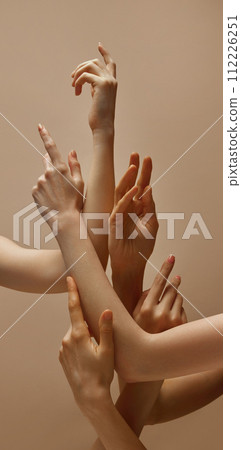 against beige studio background. against beige studio background. 112226251