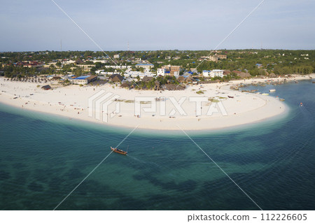 Top view of beach clear green water and wooden fishing boat 112226605