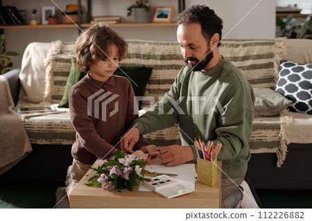 Helping father prepare gift for mother Helping father prepare gift for mother 112226882