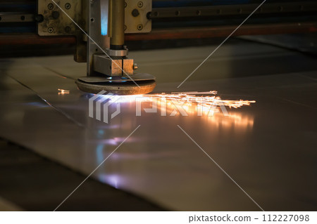 Plasma cutting of metal.Cutting of metal. Sparks fly from laser Plasma cutting of metal.Cutting of metal. Sparks fly from laser 112227098