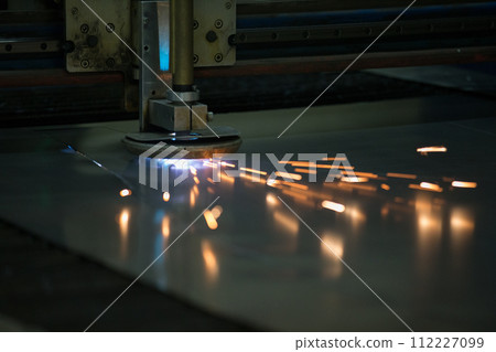 Plasma cutting of metal.Cutting of metal. Sparks fly from laser 112227099