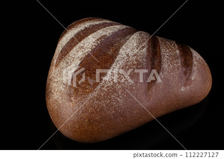 Bread on a dark background.Loaf Bread on a dark background.Loaf 112227127