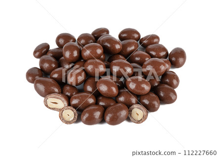 A bunch of dark chocolate peanuts isolated on a white background. A bunch of dark chocolate peanuts isolated on a white background. 112227660