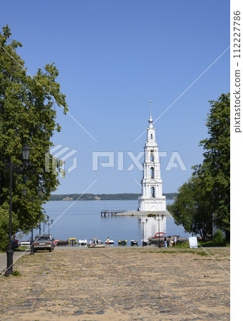 Volga River and bell tower of St. Nicholas Cathedral built in 1800 remained after flooding 112227786