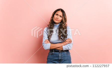 Upset woman with arms crossed standing disappointed 112227937
