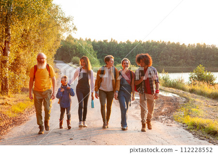 Multigenerational Friends on a Sunset Nature Walk Multigenerational Friends on a Sunset Nature Walk 112228552