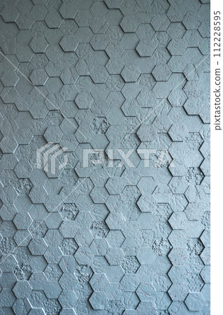 Background made of grey hexagonal gypsum tiles, textured, mosaic. 112228595