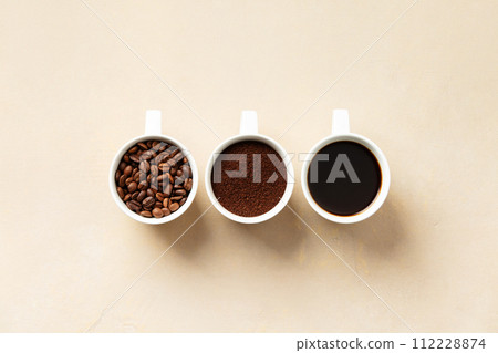 Stages of Coffee Preparation in White Cups Stages of Coffee Preparation in White Cups 112228874