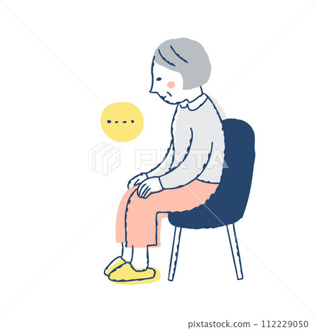Senior woman sitting absentmindedly on a chair 112229050