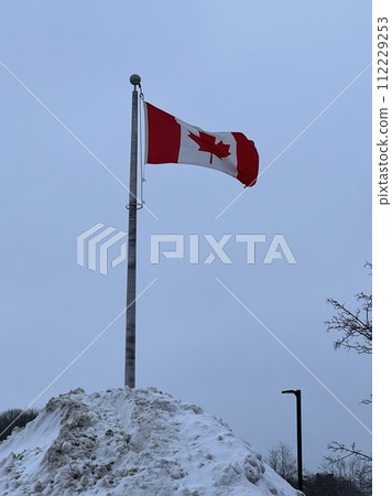 Canadian flag flying in the sky Canadian flag flying in the sky 112229253