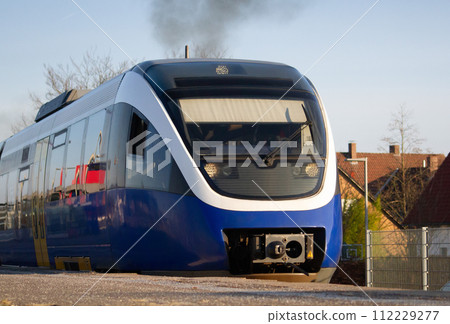 German regional train against the backdrop of houses  112229277