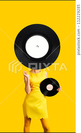 Contemporary art collage. Young woman with huge vinyl audio recorder posing holds smaller vinyl cassette against vibrant background. 112229285