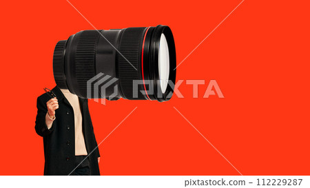 Contemporary art collage. Young man in black trench with huge modern photo camera instead of head against vibrant background. 112229287