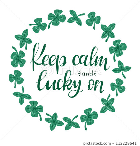 Calligraphic Irish lettering in shamrock wreath. Slogan Keep calm and lucky on isolated on white background. Irish culture concept. Vector typography design for banner, poster, card. 112229641