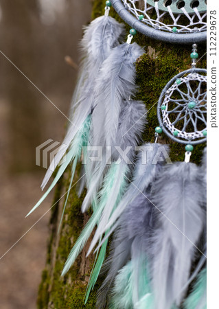 Handmade dream catcher with feathers threads and beads rope hanging Handmade dream catcher with feathers threads and beads rope hanging 112229678