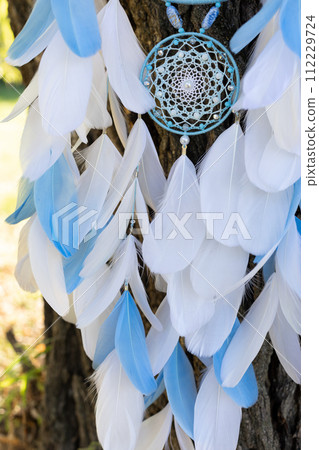 Handmade dream catcher with feathers threads and beads rope hanging Handmade dream catcher with feathers threads and beads rope hanging 112229724
